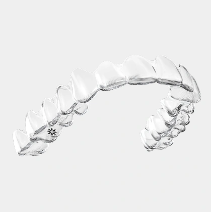 Clear plastic dental aligners displayed against white background showing orthodontic treatment device