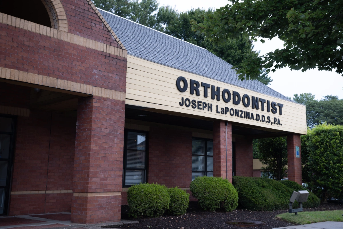 Orthodontist office storefront with brick exterior and signage for Dr. Joseph LaPonzina's practice.